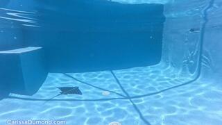 Carissa in the swimming pool with nose clip, black pantyhose, and no mask while masturbating