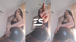 Smoking with a view in a leather skirt and bra