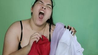 Yawning While Trying On Tops