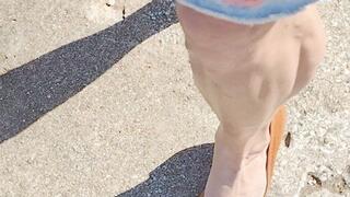 Walking in tan leather wedges