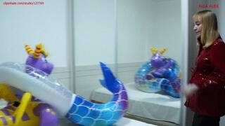 Alla deflates a rare magical inflatable dragon and an inflatable mermaid ring