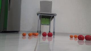 faces on tomatoes and oranges