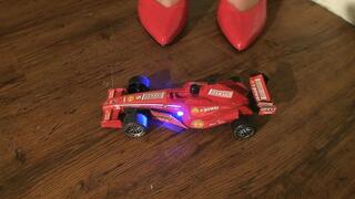 F1 Car Crushed Under Sophies Red High Heels