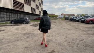 The girl was walking in the parking lot in high-heeled shoes, but she twisted her leg badly, and now it hurts too much to step on her sore foot