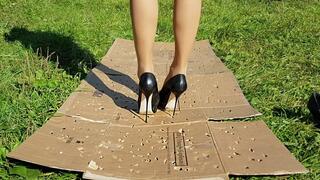 high heels crushing big piece of cardboard, cardboard crush, shoes crush, high heels stomping