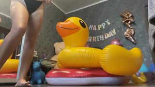 Valeri riding on 2 inflatables toy