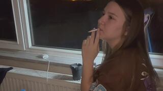 YULIANA SMOKE BY THE WINDOW