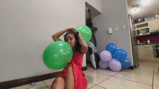 Akina hangs balloons on her head