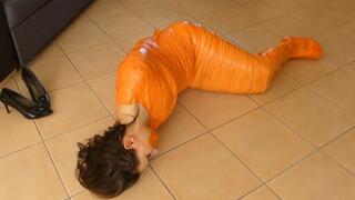 Chloe wriggle mummified in orange tape
