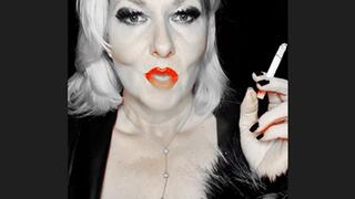 Smoker queen Joan pulls her marlboro red 100 very closly so sexy between her bright red juicy lips that glows just like her red bra