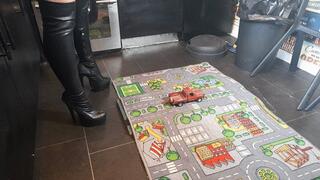 MissaRaeBerry toy car crush 1970s Chevrolet pickup in black knee high high heeled boots high left view