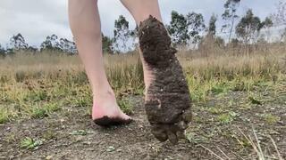 Bare soles covered in sticky dirt