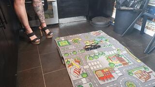 MissaRaeBerry toy car crush 1969 Ford Mustang in chunky heels High left view