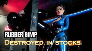 EvilWoman: Rubber gimp destroyed in the stocks