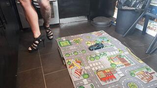 MissaRaeBerry toy car crush Ford Mustang Cobra in high heels high right view