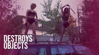 DESTROYS OBJECTS Two girls smashes dishes on a car