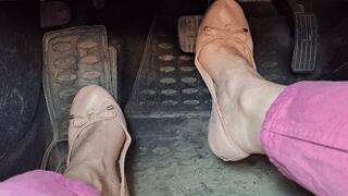 Pedals pumping in pink ballet flats