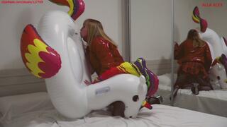 Alla inflates an inflatable unicorn with her mouth and fucks it hard and wears a shiny down jacket