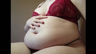 Sensual playing with big fat belly and boobs in tight lingerie