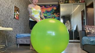 looner girl jump on green beachball