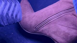Up close to my foot revving in brown knee high boots
