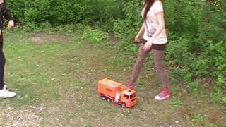 two girls crush a car