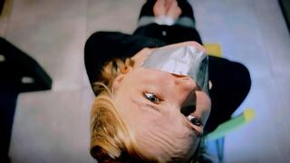 Reporter Scooped - Sunny Vanna - reporter, captured, black blouse, black pants, barefoot, chair tied, duct tape, taped up, tape gagged