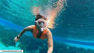 Carissa in the orange dive skin in the spring freediving part 1