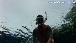 Carissa in the orange diveskin in the spring freediving part 2