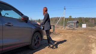 Businesslady in leather boots goes through the mud because her car can't drive on such a road, and she really needs to get to the right place (short version)