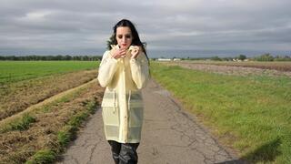 Amira in transparent Schmuddelwedda raincoat and rainpants