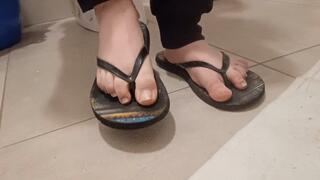 sweaty and dirty feet in flip flops