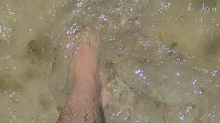 Showing off my feet in the ocean