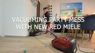 Vacuuming party mess with new red miele