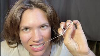 Nail Goddess gum chewing & popping with natural, long, sharp nails