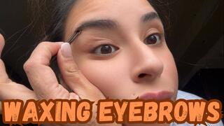 Waxing eyebrows