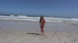 Stripping and frolicking on a public beach