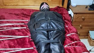 Handjob on a man in sleepsack by woman 1-BBW domination,BBW bondage,man in bondage,male bondage,man tied up,leather sleepsack,sleep sack,amateur, bound and gagged man,bed bound,handjob,cock and balls tied,edging,edged,