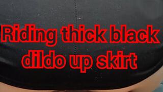 Riding thick black dildo up skirt