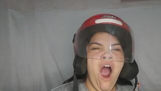 Tired yawn on a motorcycle helmet