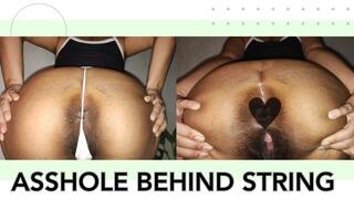 Asshole behind g-string