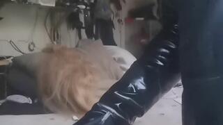 Smoking in a nice leather outfit wearing pvc gloves
