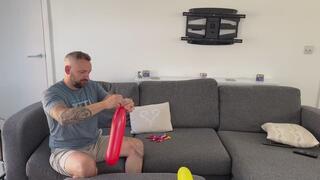 JL blowing up all the long balloons and a sneaky jewel - blow to pop squeeze to pop shred to pop