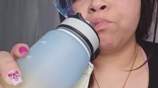 Big fat girl drinks water on a normal day