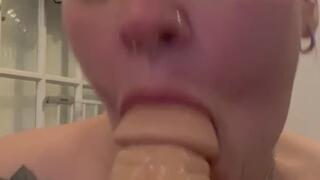 Cute BBW sucking on fat white dildo