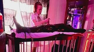 Gia has her way with Frankie on the milking table while he is completely helpless wrapped in rubber