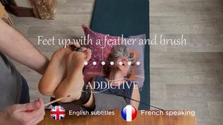 Tickles feet up with feather and paint brush ( French speaking with English subtitles )