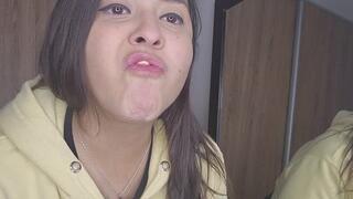 playing with gum in front of the mirror