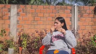 Juicy Latina Eats a Tangy Mandarin