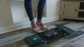 Priscilla toy car crush she crushes a 1980s Ford Mustang in block heels close left upper view her first car crush